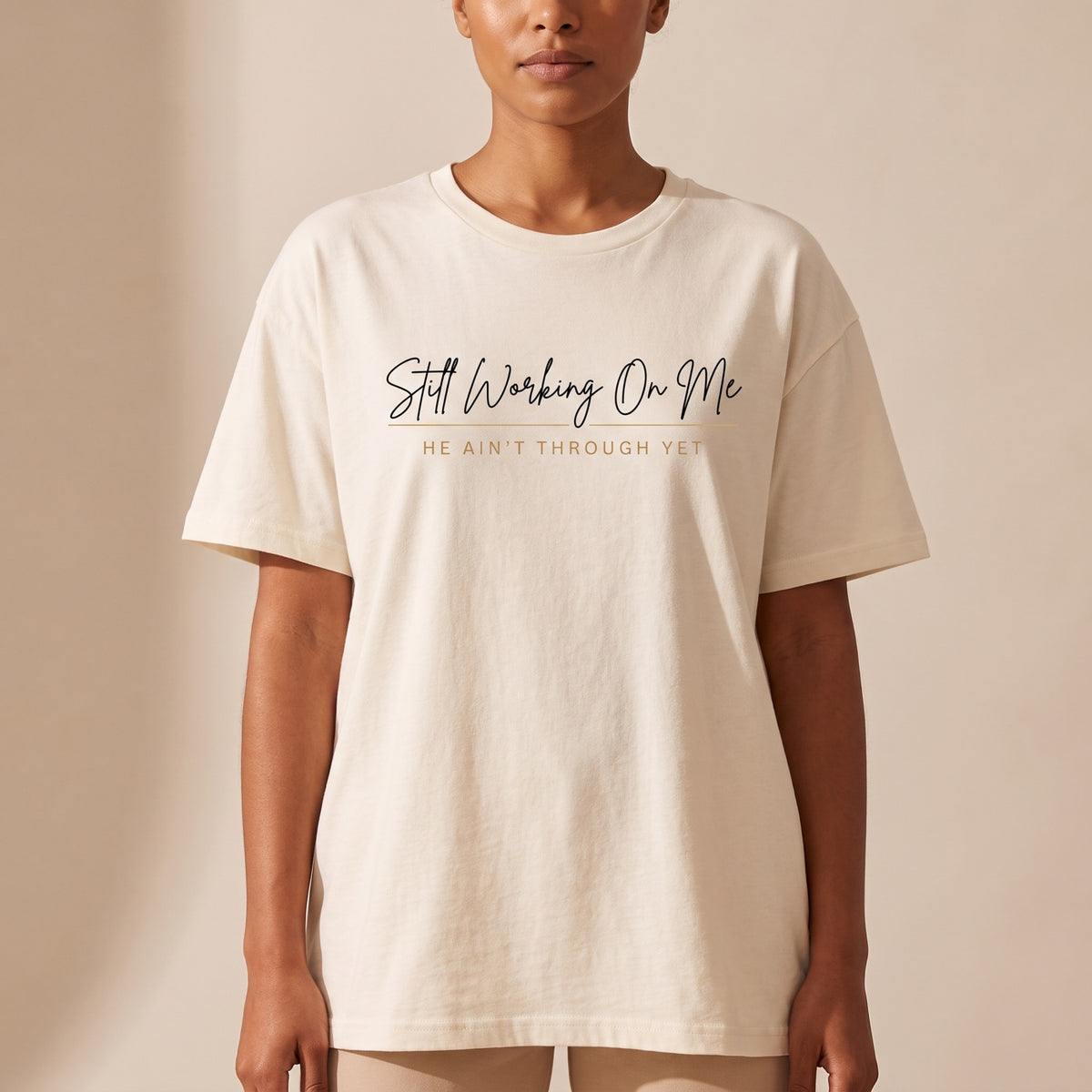 Model wearing the cream Still Working On Me oversized tee